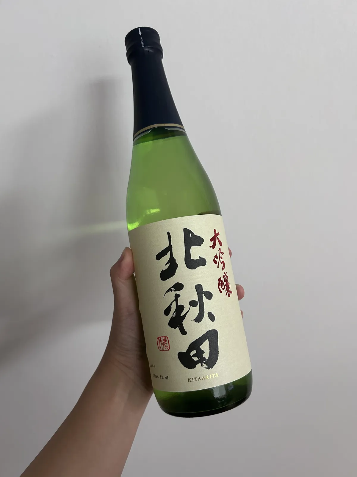 大吟醸 北秋田の正面ラベル。力強い筆文字と薄黄色の和紙風の質感が印象的